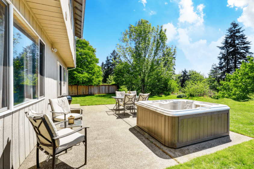 Ithaca Concrete Patio with hot tub